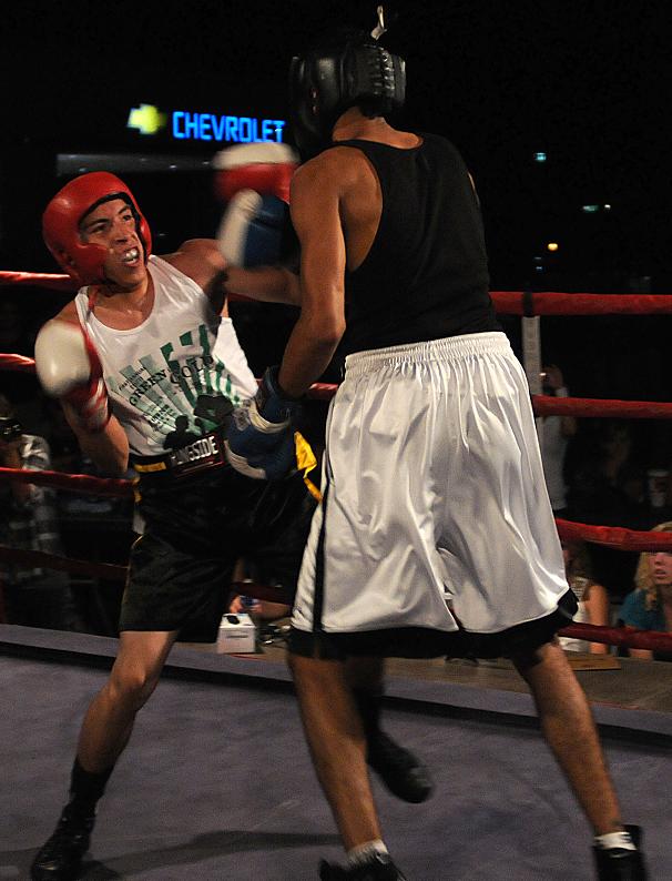 Arthor Cesena, left, waits for his opponent to make a move. Over 200 people showed up to the event Saturday to help support their local boxing club.