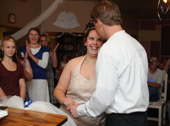 Sabrina Frasier beams up at her brand new husband, Mike Frasier, immediately after their first wedded kiss at a Camp Verde nursing home Friday, July 16. Both the bride and groom are employees of the extended care facility.