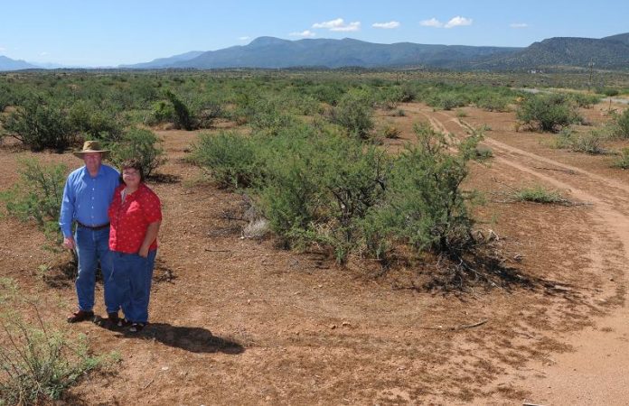 Pat and Louann Patterson show the area where they would like to build an indoor shooting range near Cherry Road and State Route 260 on Sunday, July 25. The Cornville couple received an endorsement for the project from the Camp Verde Town Council but are waiting for approval from nearby neighbors of the range before moving ahead with their plans.