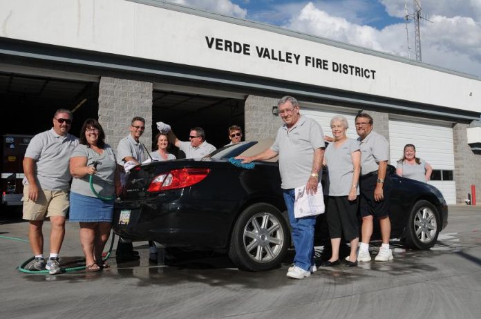 Members of the Verde Valley Fire District Charities are ready to wash cars at Station No. 31, located on Godard Road on Saturday, Aug. 14, to raise money for the purchase of free bike helmets and car seats for distribution to needy Verde Valley families.