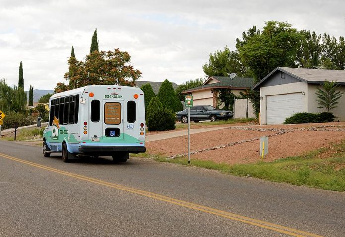 A Cottonwood Area Transit bus rumbles past an empty bus stop near Puma Circle in Verde Villages on Sept. 7. Cottonwood City Council voted unanimously later that evening to apply for emergency funding from the Arizona Department of Transportation to continue bus service in Verde Villages.