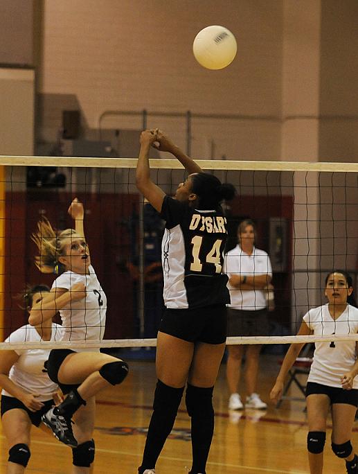 Amanda Randolph, No. 2, goes for a kill against Dysart.