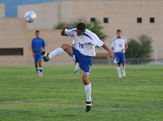 Rodrigo Hernandez looks to kick the ball downfield to a teammate Sept. 21 against Chino Valley High School.