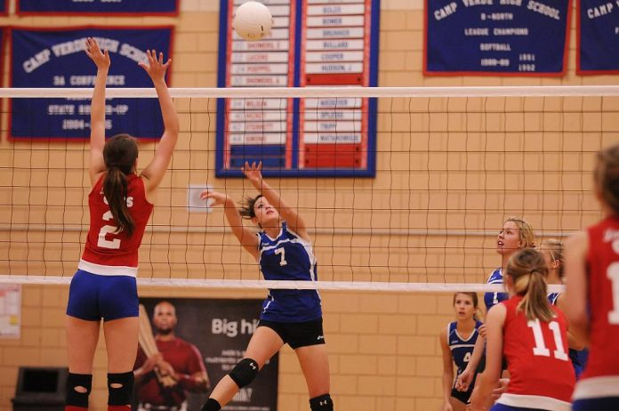 Camp Verde High School volleyball player Jenny Lawler, No. 7, second from left, nails a hit past a Mayer High School player during a home game Thursday, Sept. 30. The Cowboys took the match in three quick games.