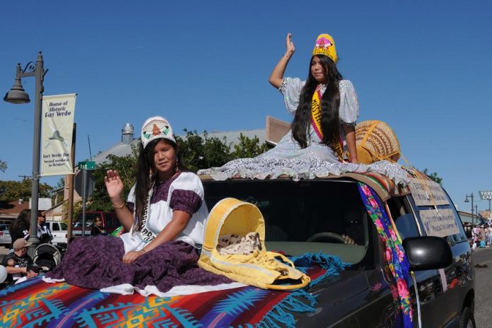 Miss 2010-2011 Teen Yavapai-Apache Nation Philana Grass, top, and princess Trina Honwytewa ride through capturing first place in the Our American Heritage category.