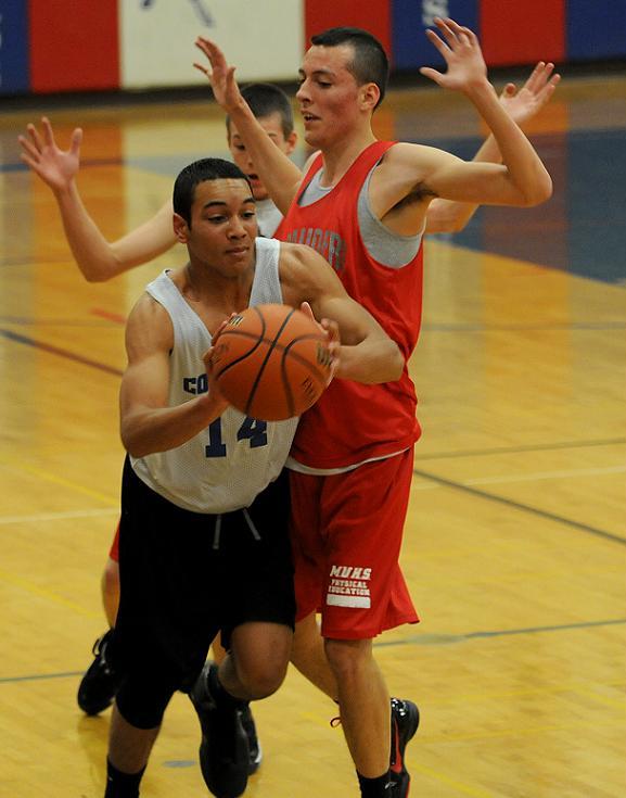 Junior Deshon Tripp, left, looks to pass to an open teammate in a scrimmage game Thursday, Nov. 18, against Mingus Union High School. Tripp and his Cowboy teammates begin the 2010-2011 season with one of the more talented core groups in recent memory.