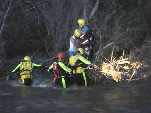 Lake Montezuma-Rimrock and Camp Verde fire district swift water rescue personnel prepare the retrieve two boys stranded in Beaver Creek on Thursday, Dec. 23.