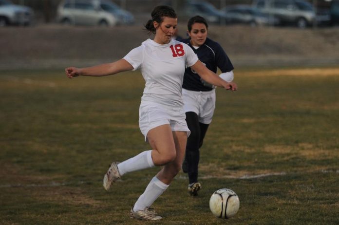 Mingus Union High School girls varsity soccer midfielder Lashea Taylor moves the ball downfield during a home match against Independence High School played on the Camp Verde High School field Nov. 30 (left). Mingus won the match with a score 5-0. The Marauders played Notre Dame Preparatory Academy on Tuesday, Dec. 7, and lost 2-1.