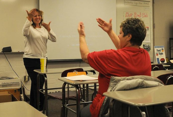 Sign language teacher Lisa Franklin, left, signs with student Dale Williams during class at Mingus Union High School on Monday, Nov. 29. The six-week class, which will repeat in the spring, was free to educators and relatives of deaf students in the Verde Valley.