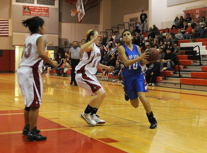 Donnie Buss drives for the basket during an away game at Mingus Union High School on Friday, Dec. 17. Moments later Buss put the points on the board to put Camp Verde High School ahead by one point ending in a final score of 36-33 in the Cowboys’ favor.