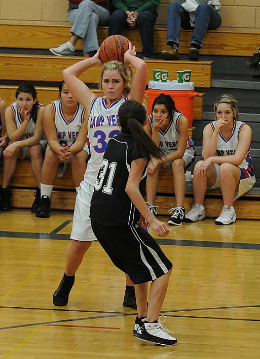 Tori Mathews looks for an open teammate during the first game during the first round of play at the Yvonne Johnson Memorial Shootout on Dec. 29. The Cowboys went on to win the tournament by beating Bradshaw Mountain High School, 44-34.