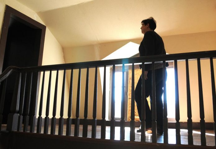 Gloria Kariya, a visitor to Camp Verde from Layton, Utah, explores the buildings at Fort Verde State Historic Park on Friday, Jan. 21. Although visitation to the park has remained steady during the second quarter of fiscal year 2010-11, the number of visitors in December 2010 dropped 43 percent from the number of visitors to the fort in December 2009.