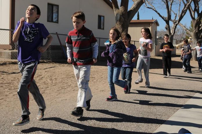 A group of children participating in a Fit Kids running program head off for a jog around the fields adjacent to Cottonwood Elementary School on Feb. 9. The one-hour program every Wednesday afternoon goes for eight weeks at a cost of only ten dollars to each participant and a program t-shirt is included. The program currently has approximately 50 children participating in games which involve running, jogging and sprinting.