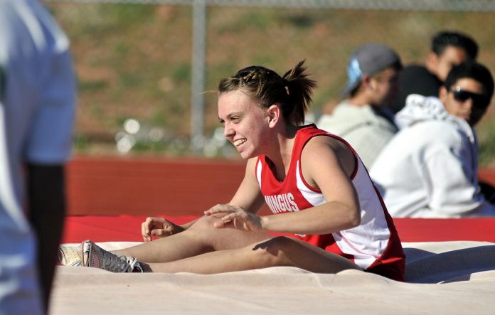 Junior Stephanie Gilboy shows her excitement at the Sedona Invitational on March 23 after setting a personal best in the pole vault at 9 feet, 6 inches.