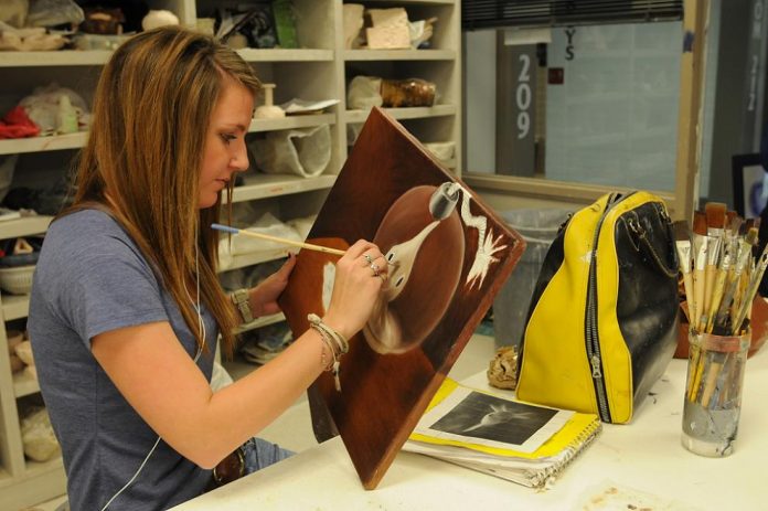 McKenzie Mabery, junior at Mingus Union High School, concentrates on her painting project in fine arts teacher Tyler Novak’s class on Monday, May 2. Novak was given the green light from the MUHS District Governing Board on April 14 to start working with other MUHS teachers in crafting a liberal arts-based curriculum for college-bound students.