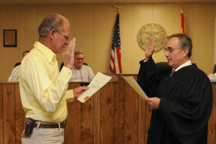 Returning Mayor Bob Burnside, left, is sworn in by Judge Harry Cipriano at the Camp Verde Town Council meeting Wednesday, June 3. Council welcomed newcomers Alan Buchanan and Bruce George.