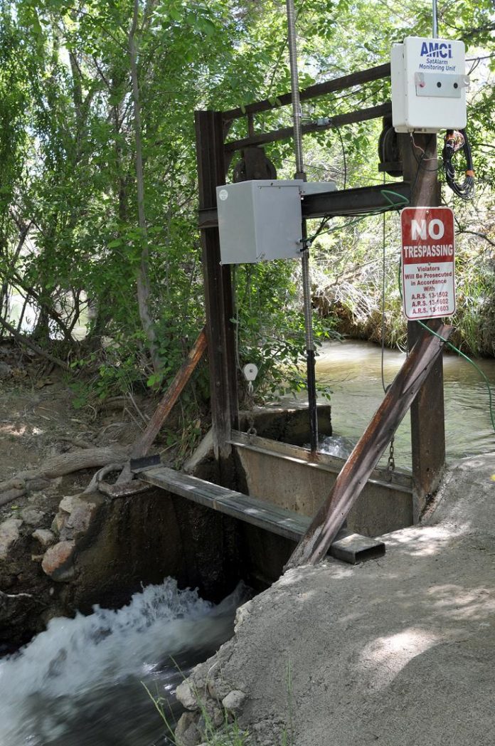 An automated ditch system, which is solar powered, allows water to flow upstream from White Bridge in Camp Verde on Thursday, May 9. The system adjusts automatically to keep levels constant, and unused water is returned to the river.