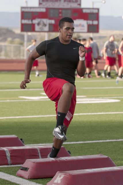 Mingus Union football senior and defensive captain Alec Eppingen practices leg kicks Thursday, June 6, during summer practice at Mingus Union High School in Cottonwood.