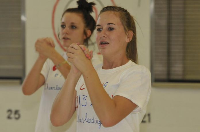 Kayla Brashears and Tyla Peterson clap out a cheer in unison at the Camp Verde Spiritline practice on Friday, Aug. 9.