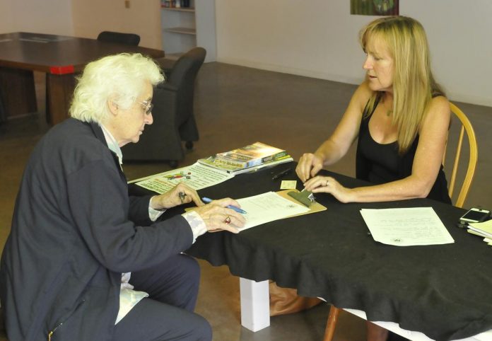 Casework manager Judy Sulltrop counsels Camp Verde resident Fran Arries on July 24. U.S. Rep. Ann Kirkpatrick [D-District 1] and her staff plan to host similar office hour sessions in Camp Verde at the old Boler’s building.