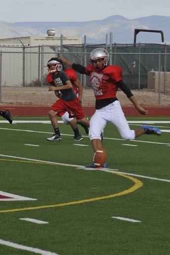 Jahir "JJ" Jacobo of the Mingus Union football team kicks off during drills at the high school Tuesday, Aug. 27.