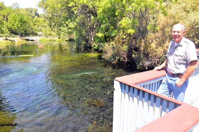 Wade Zarlingo, manager of the Page Springs Fish Hatchery, overlooks one of the many ponds on the property.