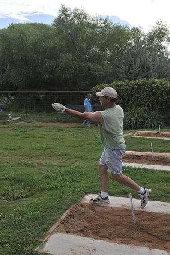 David Lewis, of the Cornville Cartel, pitches a horseshoe July 26 at Windmill Park in Cornville. The group plays for three hours every day and holds tournaments on Sundays every week or two.