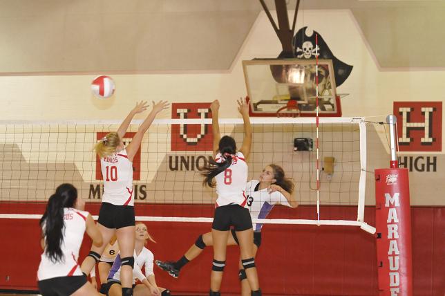 Sarah Cochrane, [10], and Sarah Ortiz, [8], go up for a block in the match against the Sedona Red Rock Scorpions in the Mingus gymnasium on Thursday, Sept. 5.