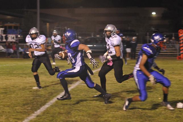 Jordan Reay takes off on a long gain in the first half of the Cowboys' homecoming game against Sedona on Friday, Sept. 27, in Camp Verde.