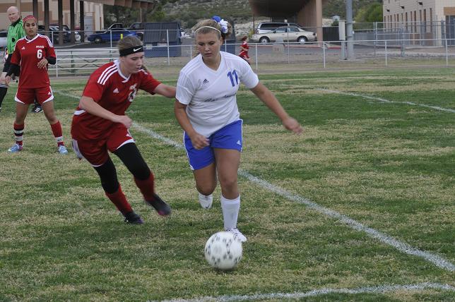 Paige Church dribbles the ball upfield in Camp Verde's game against the Dust Devils.