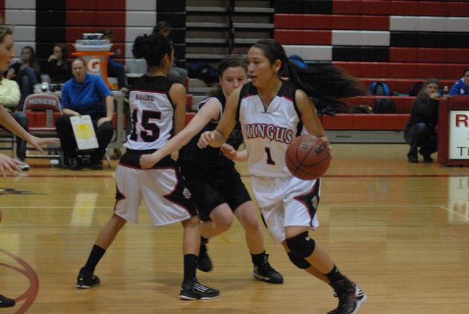 Senior guard Angel Chavez dribbles past a defender in a Marauders game last season.