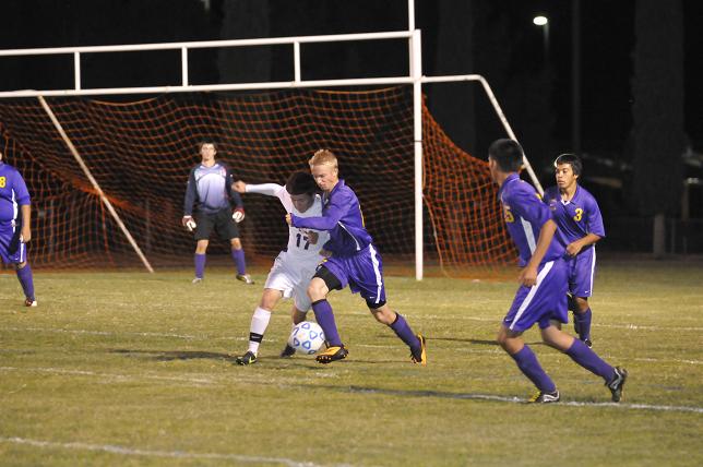 Cowboys freshman Ezekiel Casillas fights for the ball in a game against Payson earlier this season.