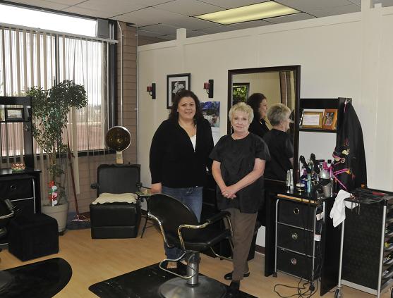 Owner Gloria Brooks, left, and Karla Sterrett work in a Cottonwood hair salon. Services they provide such as cutting, coloring, and styling hair are not taxable. However, any products they sell, like shampoo, conditioner, hairspray and gel are taxable, because they are a physical product.