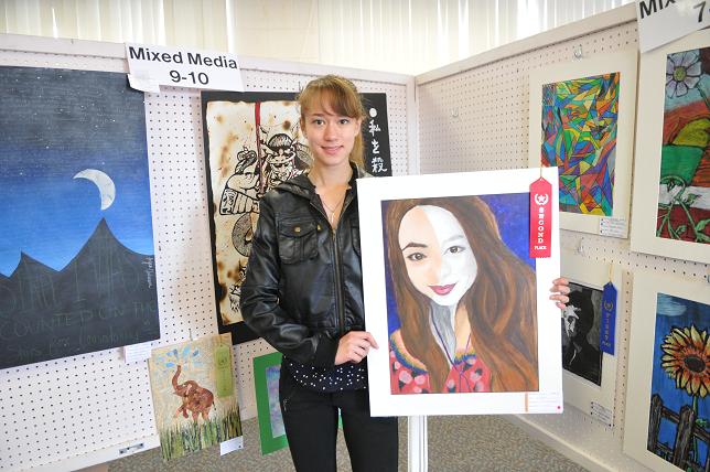 Victoria DuCharme, of Mingus Union High School, holds her painting that won a second place ribbon in mixed media on Saturday, April 26, for the Northern Arizona Watercolor Society’s Student Art Show at Sedona Red Rock High School. The show, in its 24th year, brought in 491 pieces of art from 12 schools from Flagstaff and the Verde Valley.