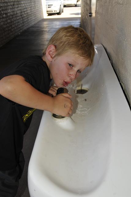 Cameron Contreras gets a drink of water from a fountain at Clarkdale-Jerome School on Saturday, June 7. While fountains turn off automatically, most faucets, showers and spigots do not. The Verde Natural Resource Conservation District is putting together a water conservation program aimed at children to teach them the importance of saving water and not letting a faucet run.