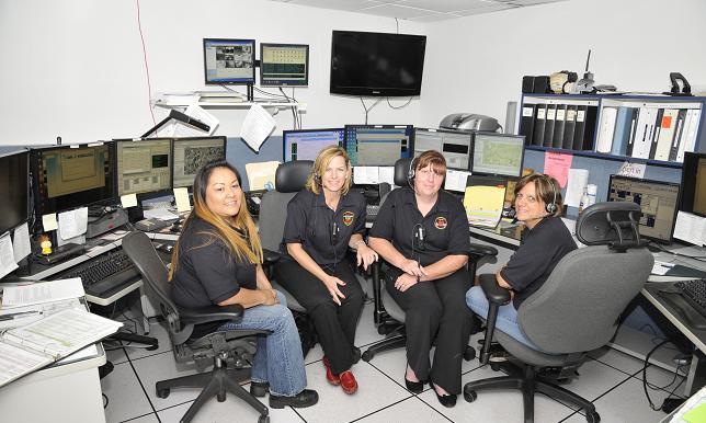 Dispatch Trainee Michelle Etcitty, dispatcher Gretchen Groseta, Dispatch Manager Marie Carpenter and dispatcher Melanie Corsette, from left, answer 911 calls and send appropriate help. Cottonwood’s police dispatch recently expanded its services to include dispatching for the fire department, as well as surrounding towns, reinforcing the need for the new dispatch center currently under construction.