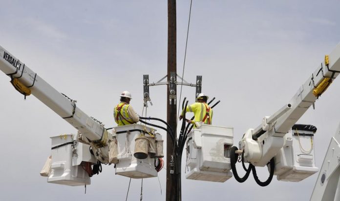 A crew from Arizona Public Service installs a new power-line pole on the corner of Finnie Flat Road and Cliffs Parkway in Camp Verde. The old pole was knocked down in a storm the night before. The town’s fiscal year ended in June, so the new pole installation will be a part of this year’s budget.