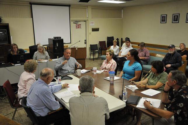 Camp Verde Town Manager Russ Martin, fourth from left, addresses the Town Council and the audience on the issue of the new library project. The new library hit several road bumps, mainly due to cost and budget concerns.