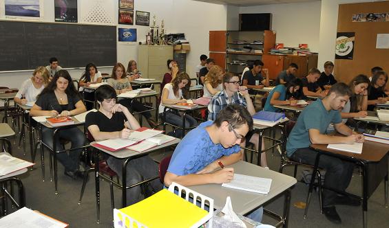 Craig Mai’s precalculus class takes notes as he demonstrates how to solve an equation on the board. Arizona’s Instrument to Measure Standards scores have been released, and Mingus Union High School earned a B, with a 61 in math.