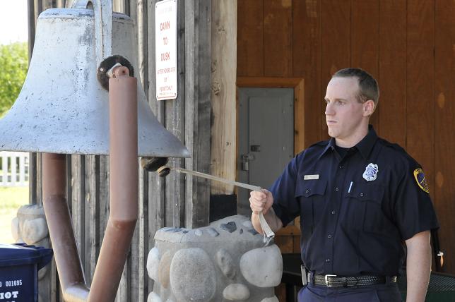 Camp Verde Fire District firefighter J. Gable rings the bell at Camp Verde’s Ramada, Striking the Four Fives at the beginning of the 9/11 memorial put on by the American Legion, then again for each war our nation has participated in.