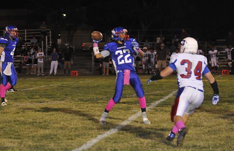 Dylan Dacuycuy, No. 22, launches the ball during a 57-0 loss to Joy Christian High School. It was the last home game for Dacuycuy and eight other Cowboys seniors.