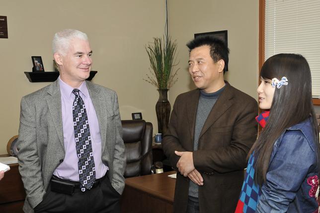 Paul Tighe, superintendent of the Mingus Union High School District, left, was shadowed by Principal Ge Shimin, center, last week, who traveled to the Verde Valley from the Hebei province of China. In March, Tighe will have the opportunity to travel to China for a similar experience. Yifan Lewis, of Prescott, right, helped the two school leaders by acting as a translator.