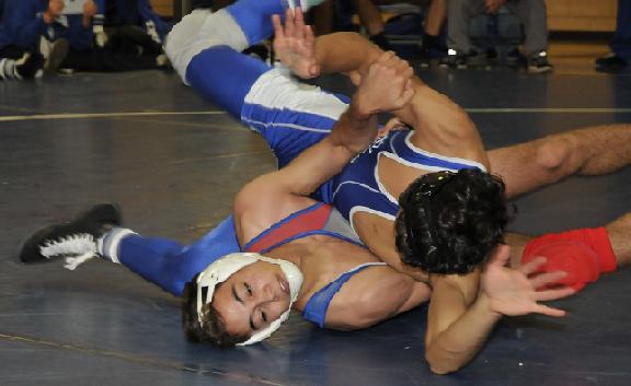 Junior Matt Mejia, bottom, wrestling Sunnyside High School’s Hector Salazar in their Dec. 10 match, was one of six champions for Camp Verde High School at the inaugural Veterans Memorial Invitational in Window Rock. The injured Mejia is scheduled to be held out of the Mile High Invitational on Friday and Saturday, Jan. 2 and 3.