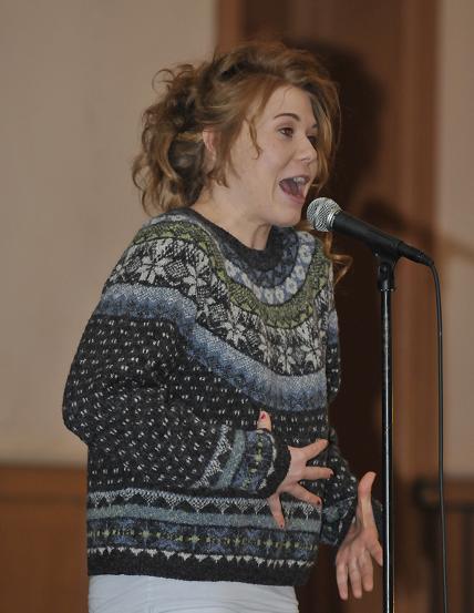 Mariah Jones reads in the poetry slam at the Clarkdale Clubhouse, part of the Made In Clarkdale art show. In slam poetry, the performer is limited to three minutes and judged by a panel of random audience members. Jones was the top teen poet and took fourth place overall.