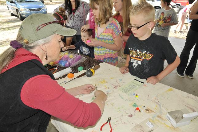 Wendy Harford shows Todd Small how to make a fishing lure from scratch at last year’s Dead Horse Ranch State Park Scitech event, complete with spinner and treble hook. The second year of the festival starts in late March.