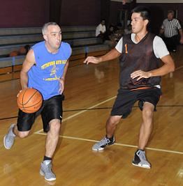 Bruce Jurecki, of Cottonwood Auto Sales, drives towards the basket in a game against Team Hostile D. The Yavapai-Apache Nation’s men’s basketball league is coming to a close, with the championship to be played Wednesday, July 8.