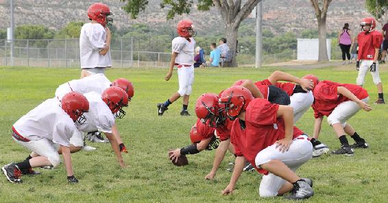 The Cottonwood Wildcats run plays to prepare for the upcoming High Desert Youth Football season. The team is the oldest one in the Cottonwood-based youth football league, with its first game Saturday, Aug. 29, at 2 p.m. against Prescott.