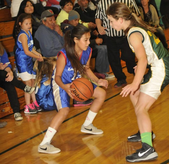 Clarkdale-Jerome School eighth-grader Kayla Bowers, right, pressures the Camp Verde Middle School ballhandler. The Mingus Rams girls team will host and open a two-day holiday tournament Friday, Dec. 11, against Cottonwood Middle School.