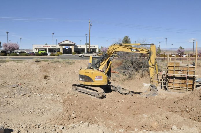 On State Route 89A, across from the Oxendale Dealership, construction equipment sits at the site of what will become a Cottonwood branch of Galpin RV. The land has been leveled, with a trench dug near the road for the installation of infrastructure.