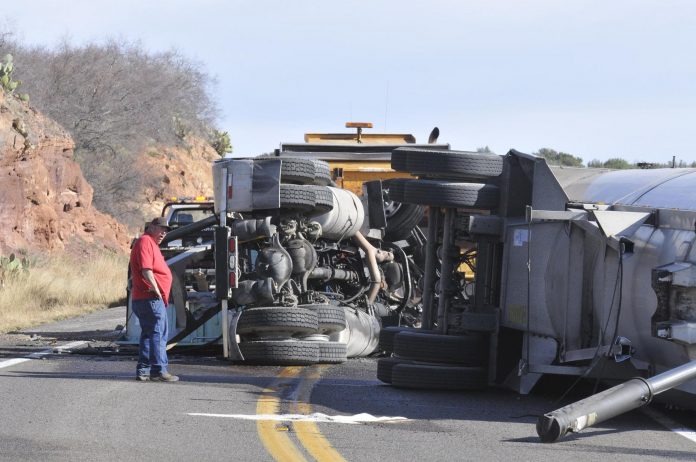 A semi truck rolled over, delaying traffic